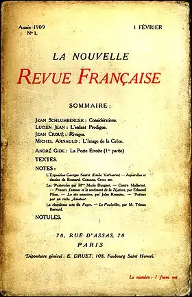 Couverture d'une revue portant des caractères noirs et rouges.