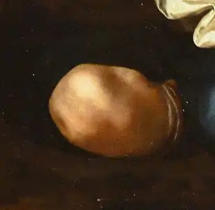détail d'une peinture montrant un genou nu replié.