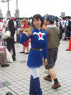 Une adepte du cosplay en costume de Nausicaälors du 70e Comic Market (Tōkyō, été 2006).