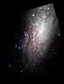 Gros plan de NGC 3621 par le télescope spatial Hubble.