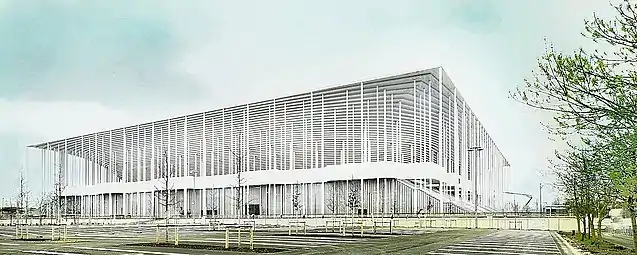 Photographie du stade Matmut Atlantique, en blanc. En avant plan, de la verdure.