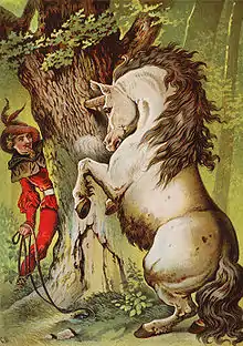image montrant un homme habillé de rouge caché derrière un arbre où une licorne a sa corne coincé