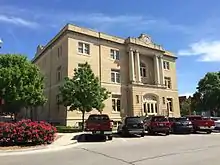 Image of Old court house with cars parked outside