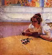 Jeune fille à table