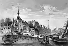porte de ville avec pont et bateaux au premier plan