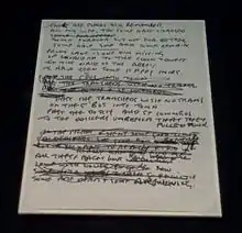 Photo d'une feuille de papier représentant les paroles d'une chanson.