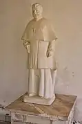 Sculpture de Preng Doçi (en) sur le portique de l'église d'Orosh en 2018