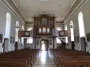 Vue intérieure de la nefvers la tribune d'orgue.