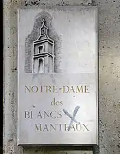 Plaque sur l'entrée nord (53, rue des Francs-Bourgeois).