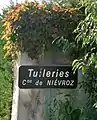 Panneau d'entrée dans Les Tuillières (sens Niévroz vers Thil).