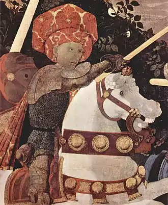 Homme à cheval portant une armure, une lance à la main.