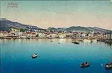 carte postale couleurs ancienne : un port au fond d'une baie