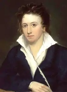 Portrait d'un jeune homme vêtu d'une chemise blanche et d'une veste noire et tenant une plume dans sa main droite
