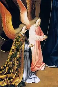 Deux anges en vêtements liturgiques.