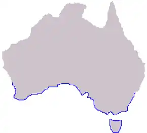 Planisphère de couleur grise représentant en bleu la présence de Phyllopteryx taeniolatus dans le monde (côtes sud de l'Australie et Tasmanie).