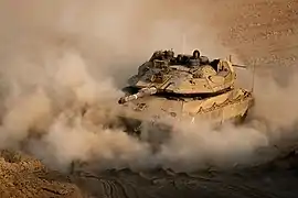 Un Merkava Mk. 4M du 82ème bataillon évoluant le long de la frontière bordant Gaza lors de l'opération Aube naissante.