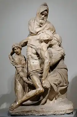 Sculpture en marbre inachevée, montrant le Christ mort soutenu par trois personnages.