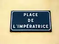 Plaque de la Place de l'Impératrice en façade de l'église