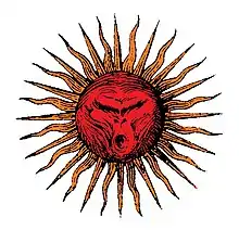 Dessin d'un soleil avec en son centre une tête de singe.