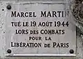 Plaque au no 221, en hommage à Marcel Martin, tué pour la Libération de Paris (1944).