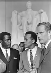 Charlton Heston lors de la marche pour les droits civiques à Washington (1963), en compagnie de Sidney Poitier et Harry Belafonte.