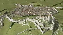 Restitution 3D au milieu du XVe siècle. Vue de l'est en plongée du château de Grimont et du bourg fortifié de Poligny (extrait de http://www.jura-3d.fr).