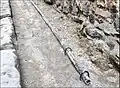 Tuyau de plomb pour alimentation en eau des latrines à Pompéi.