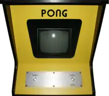 Photo d'une borne d'arcade jaune Pong.