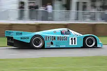 Photo d'une Porsche 962C de l'écurie Leyton House ayant participé aux 24 Heures du Mans à Goodwood