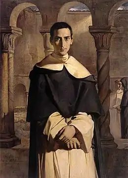 Portrait d'un jeune religieux dans le cloître d'un couvent et en tenu de dominicain.