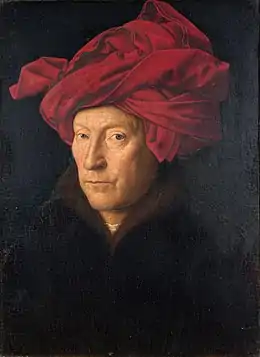 Peinture en couleurs. Buste d'un homme tourné de trois-quarts vers la gauche mais fixant le spectateur. Ses cheveux sont cachés dans un turban rouge et le sujet porte un manteau noir devant un arrière-plan très sombre.