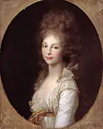 Portrait d'une jeune femme aux cheveux bouclés.