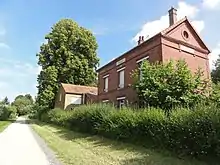 L'axe vert avec l'ancienne gare de Proisy.