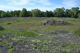 L'ancien puits Quatre de Saint-Médard-la-Rochette, après arasement (ici en août 2017).