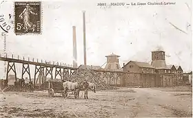 Carte postale ancienne en noir et blanc montrant les installations de surface et deux des trois puits de la fosse Chabaud-Latour des mines d'Anzin à Condé-sur-l'Escaut.