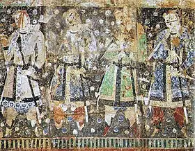 Donateurs koutchéens, aux cheveux et aux yeux clairs. Peinture murale du VIe siècle détachée des grottes de Kizil, Xinjiang. Musée d'art asiatique de Berlin.