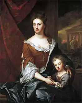 Portrait d'une femme assise avec un petit garçon à ses côtés