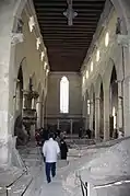 La nef basilicale, les arcades, les occuli, la chaire.