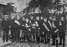 Photographie d'une équipe de football avec onze joueurs et un dirigeant
