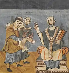 Raban Maur (gauche), soutenu par Alcuin (milieu), dédicace son œuvre à l'archevêque Otgar de Mayence (droite), manuscrit du IXe siècle.