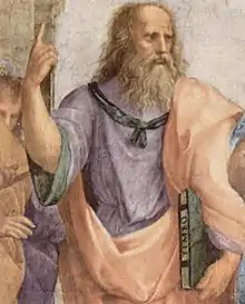 Peinture d'un vieillard portant une longue barbe et pointant son index droit vers le ciel.