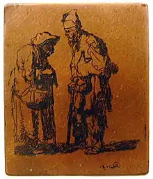 Photographie en couleurs. Sur une plaque de cuivre orangée, les creux encore encrés permettent de distinguer le dessin effectué : deux personnages âgés tournés l'un vers l'autre portent des guenilles.
