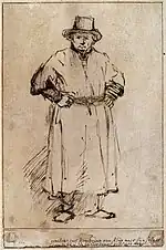 Dessin à l'encre noire sur papier sepia. Un homme est représenté complètement en pied, avec une tenue de travail et un chapeau, les mains sur les hanches.