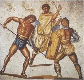 Photo couleur d'une mosaïque. Combat de deux gladiateurs armés de filet et de trident. Un arbitre en second plan.