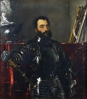 Portrait d'un homme à la barbe noire, posant dans une riche armure noire et dorée