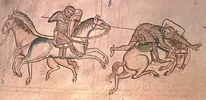 Cavalier de gauche au galop désarçonnant son adversaire et faisant chuter son cheval d'un coup de lance