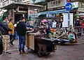 Vendeur de patates douces rôties à Hong Kong.