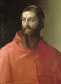 Buste d'un homme barbu vêtu d'un habit rouge.