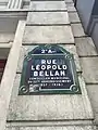 Plaque de rue de la rue Léopold-Belland.