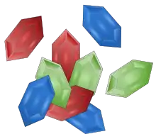Des pierres précieuses hexagonales de couleur rouge, verte et bleue.